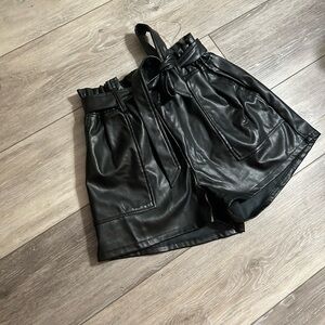 Mini black leather shorts